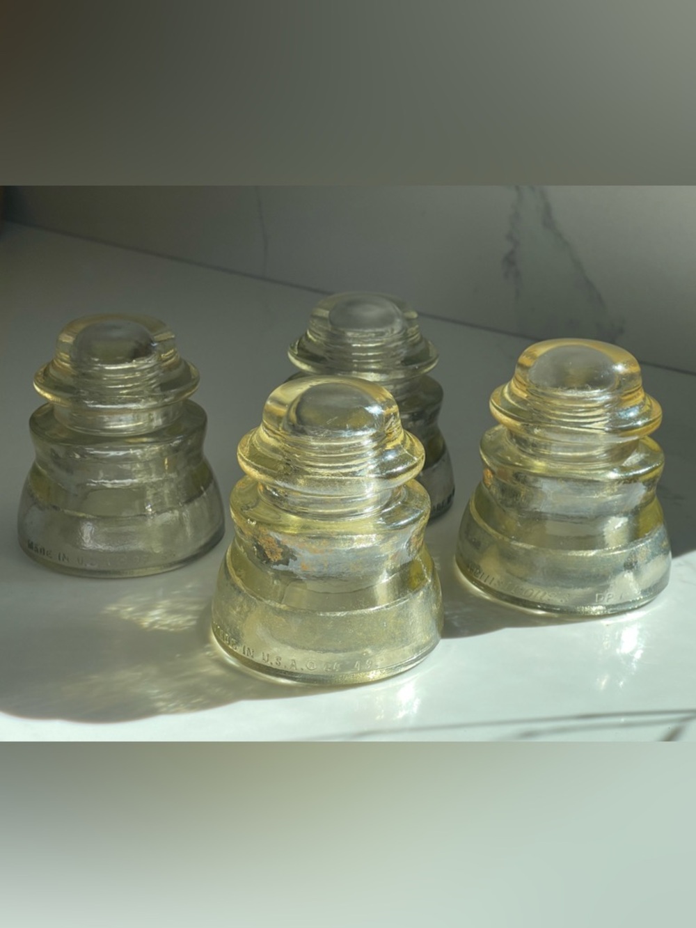 4 vintage Armstrong's T.W. clear glass insulators, 84 49